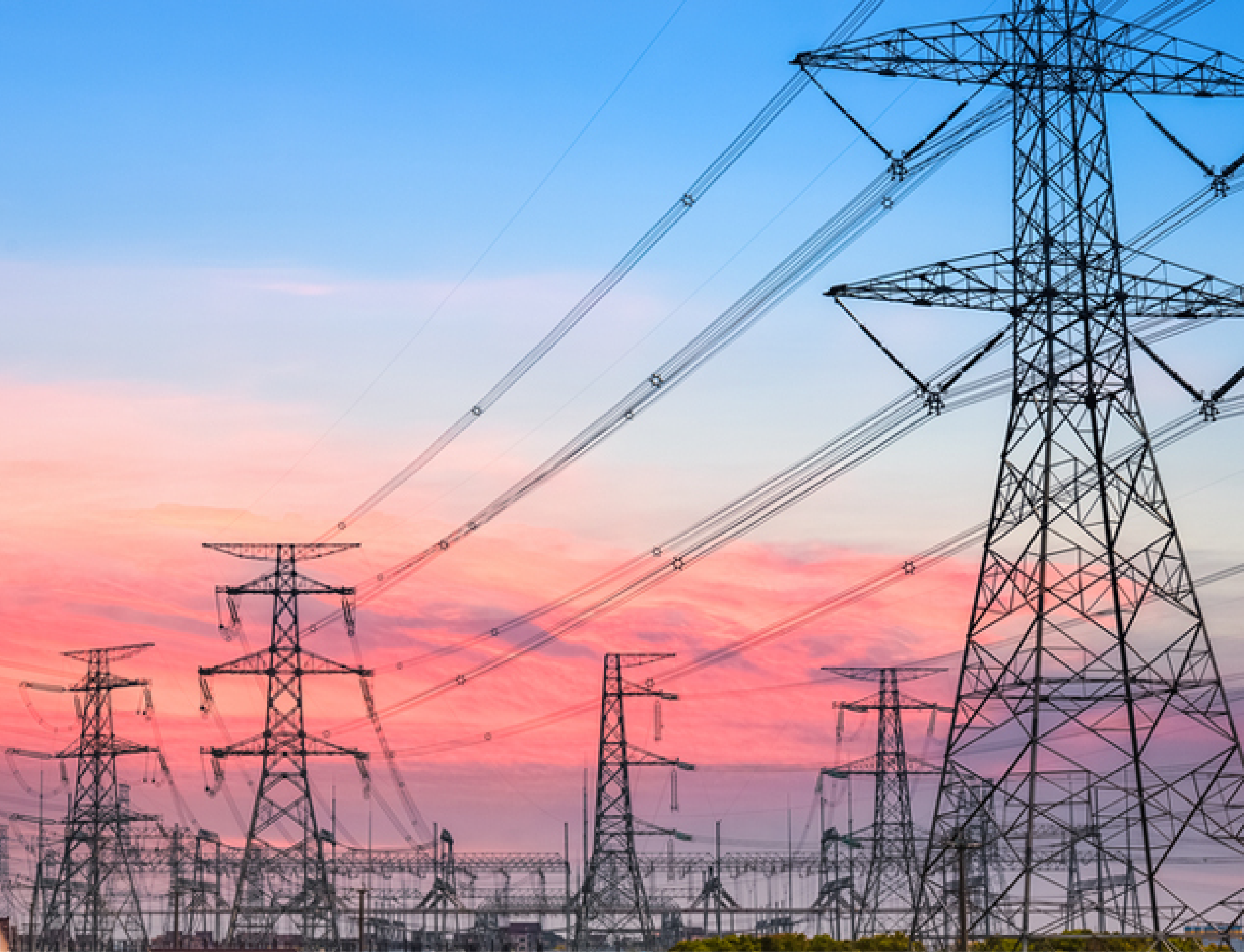 Power transmission tower silhouetted against the sunset glow